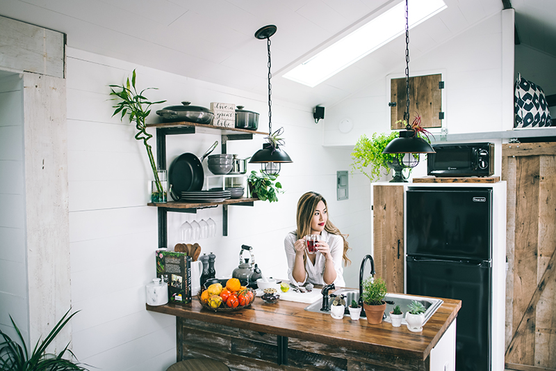 woman sits in manufactured house after mobile home loan