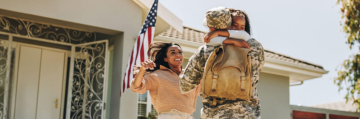 VA Mortgage Loans A veteran’s family welcoming him to their new home purchased with a VA mortgage loan