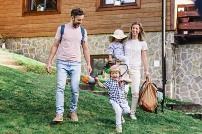 Family leaves their home as they head out on vacation.