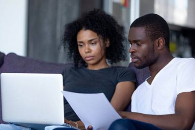 Couple looking at a laptop